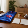 Blue child-size cape, two blank planning cards and optional soft accessories on a home table