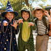 Group of boys in Book Week costumes - superhero, wizard, dinosaur, explorer and fox