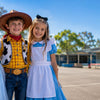 Three Australian kids dressed as Cinderella, Woody and Alice in Wonderland for Book Week