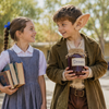 Australian kids dressed as Matilda and the BFG for Book Week — grey pinafore with blue ribbon, olive coat with giant ears and a dream jar