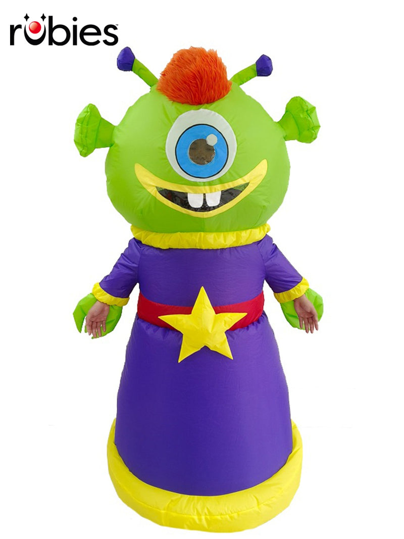 Adult wearing inflatable green alien costume with purple dress and orange hair