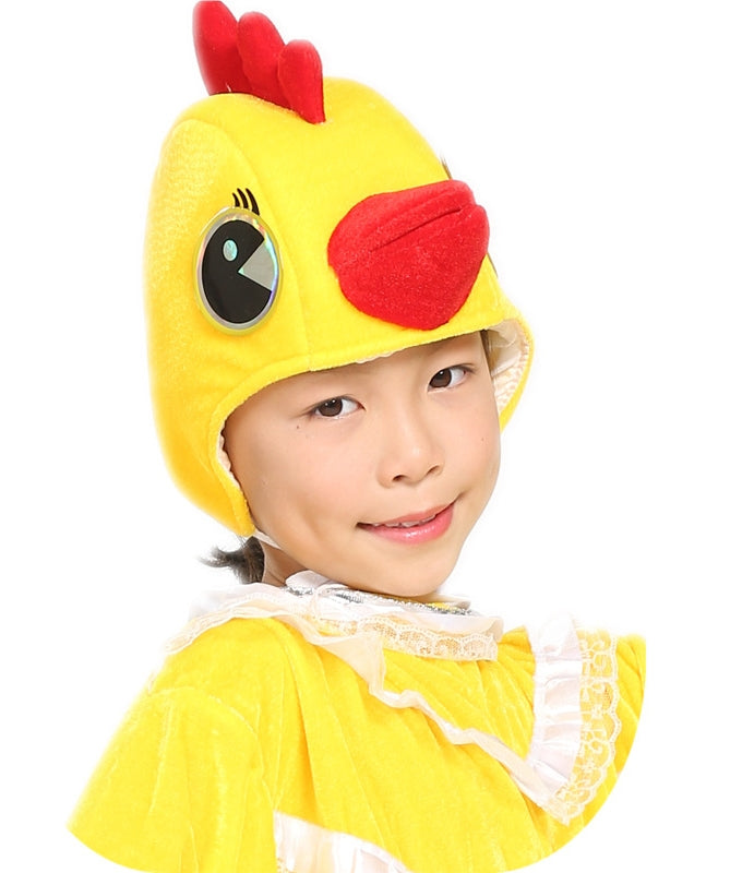 Kids plush yellow chicken headpiece with red triple-peak comb, stuffed beak and embroidered eyes on a child model