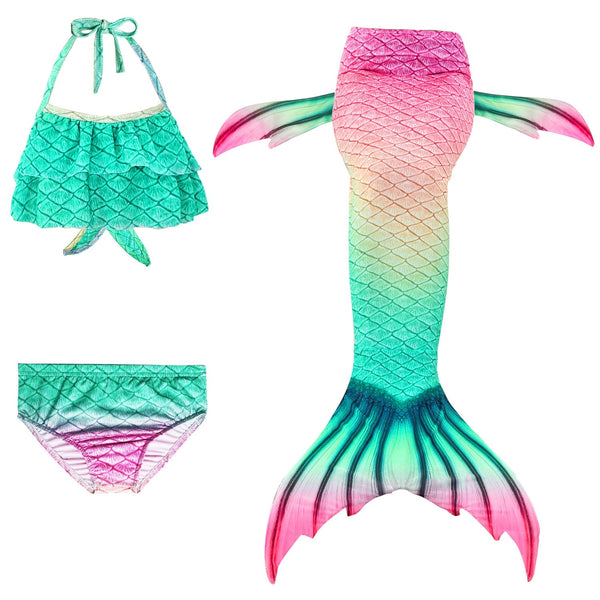 Girls mermaid swimsuit set with pink-to-teal ombrรฉ tail and halter top, laid flat showing three-piece components