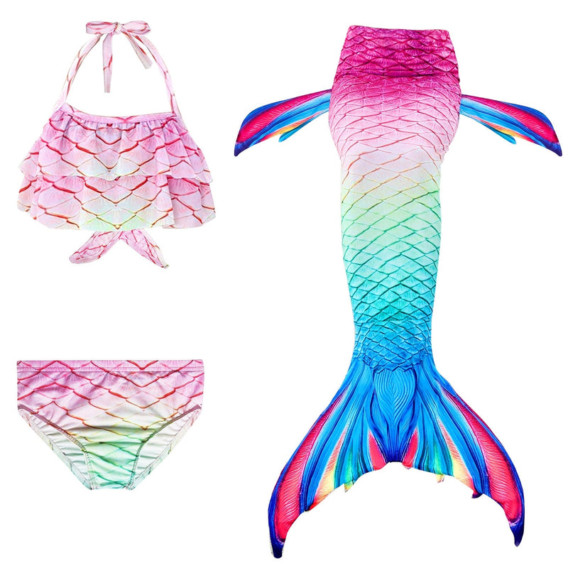 Kids mermaid costume with pink-to-turquoise ombré tail, halter bikini top, and side fins