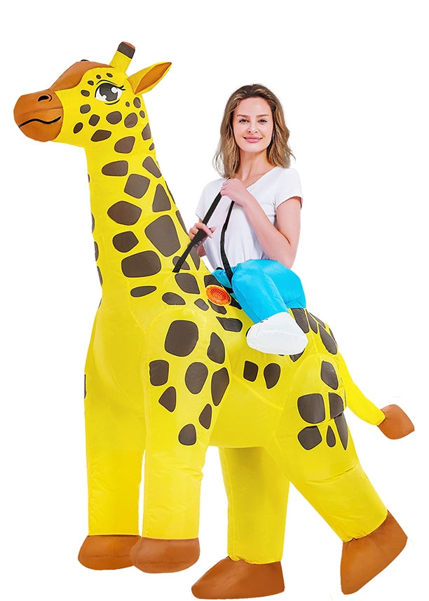 Adult wearing bright yellow inflatable giraffe ride-on costume with brown spots and blue saddle