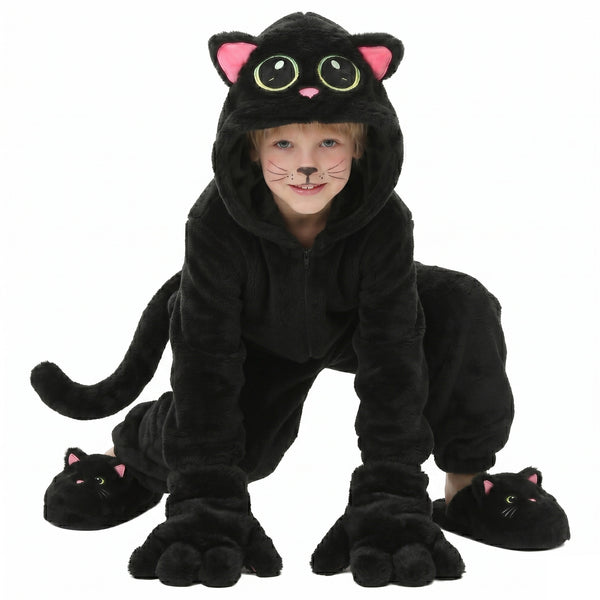 Child wearing black cat costume hooded plush jumpsuit crouching with paw gloves and tail