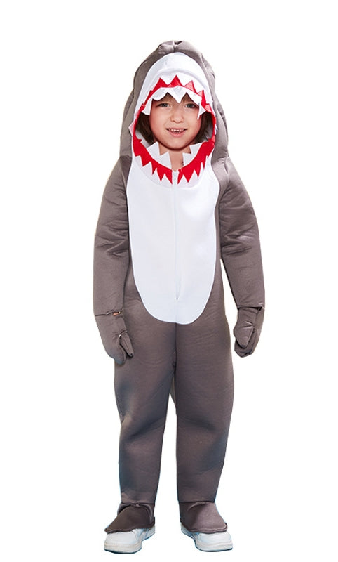 Child wearing grey shark onesie costume with white belly and dorsal fin hood