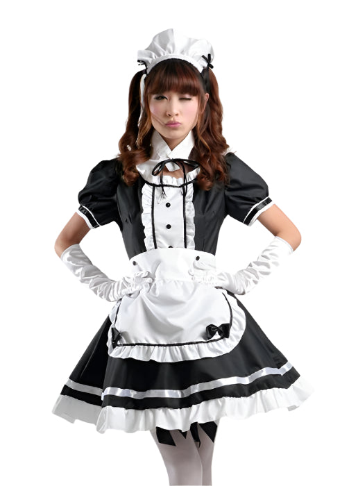 Girl wearing black and white French maid costume with frilled apron and headpiece