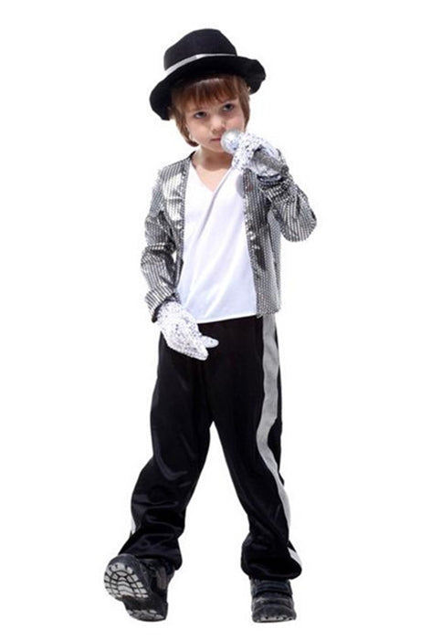 Child wearing silver sequin jacket and black fedora hat with microphone prop
