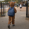 Child in a generic woodland-animal Book Week costume wearing a school backpack