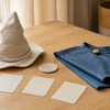 Soft costume pieces and blank sorting cards on a table after Book Week