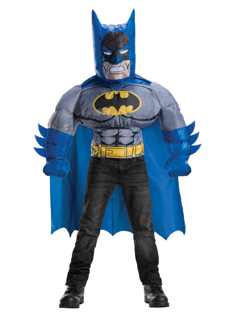 Child wearing inflatable Batman costume with muscular torso and cape