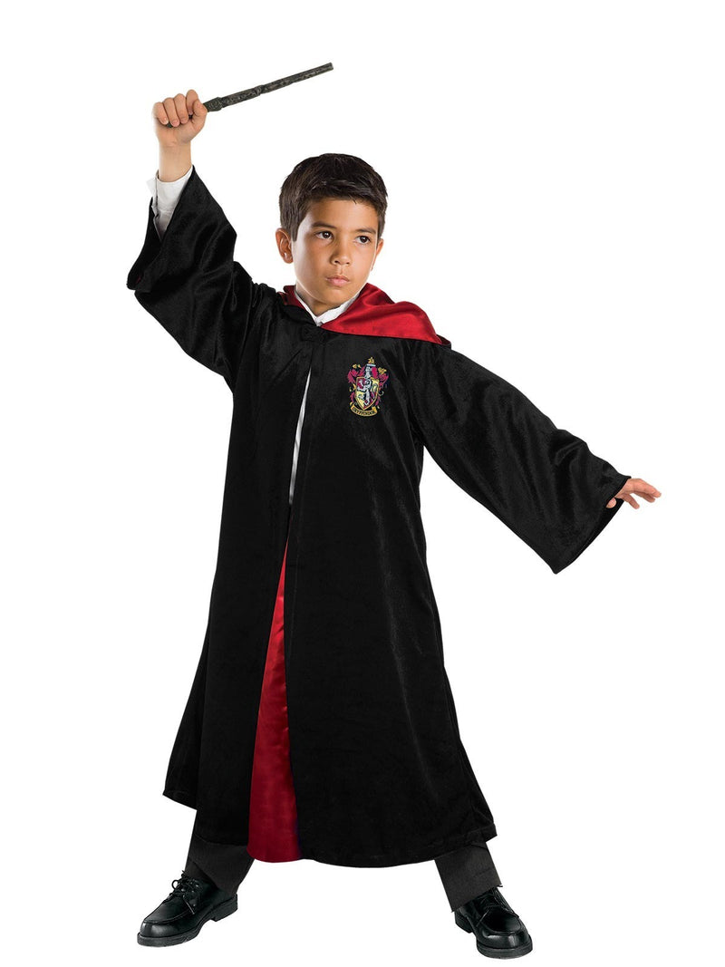 Child wearing black Harry Potter Gryffindor robe with red satin lining and house crest