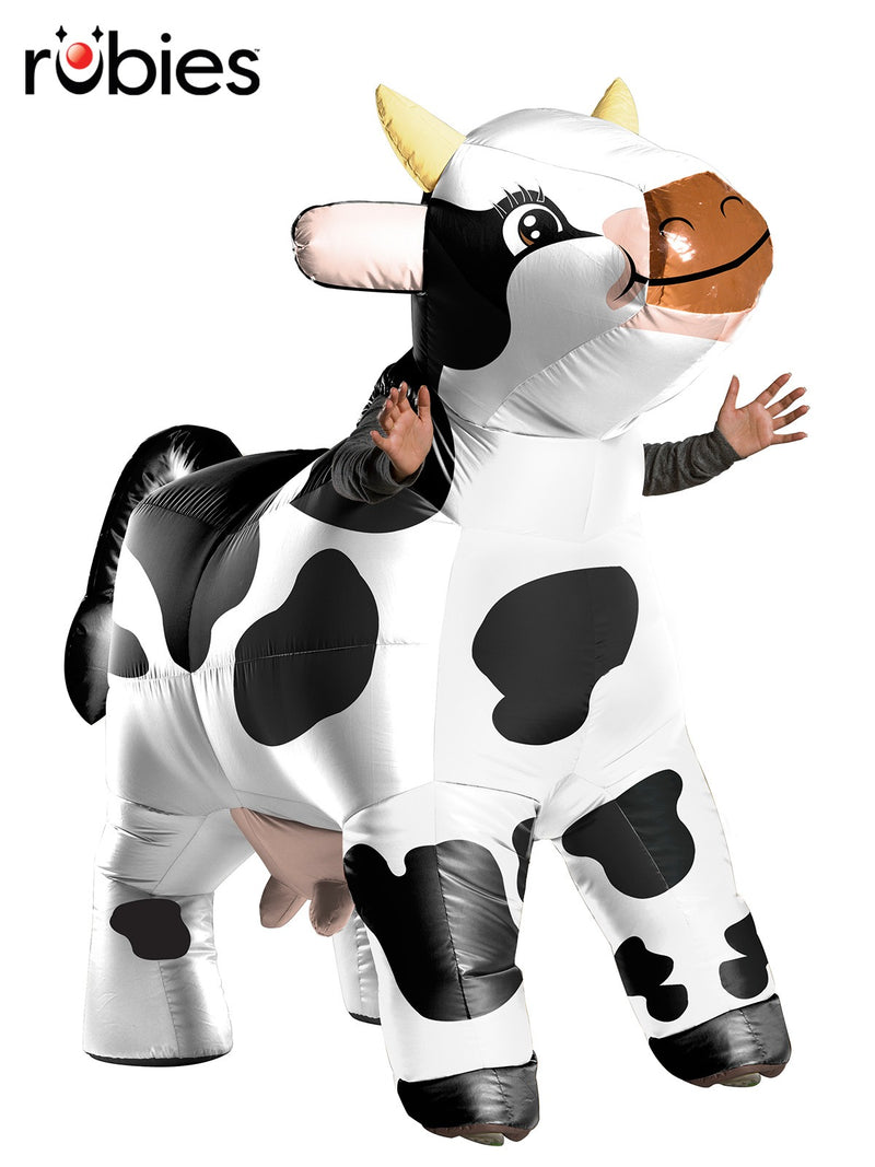 Adult wearing inflatable dairy cow costume with black and white Holstein spots, horns and tail