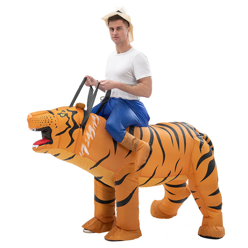 Adult riding inflatable orange tiger costume side view with roaring head