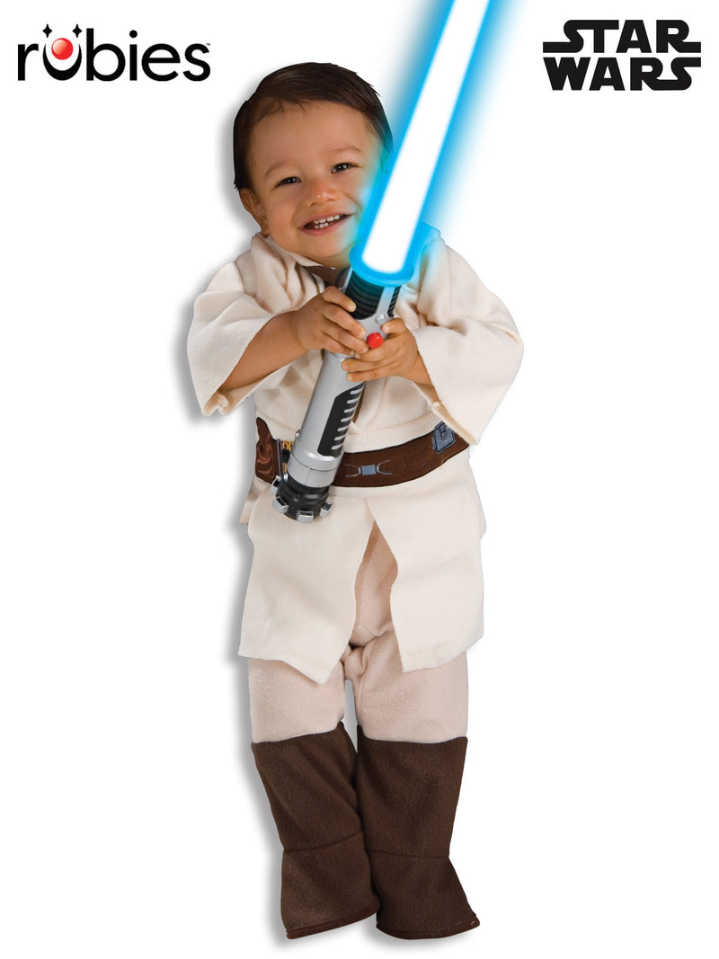 Toddler wearing cream Obi-Wan Kenobi Jedi costume with wide sleeves and brown boots