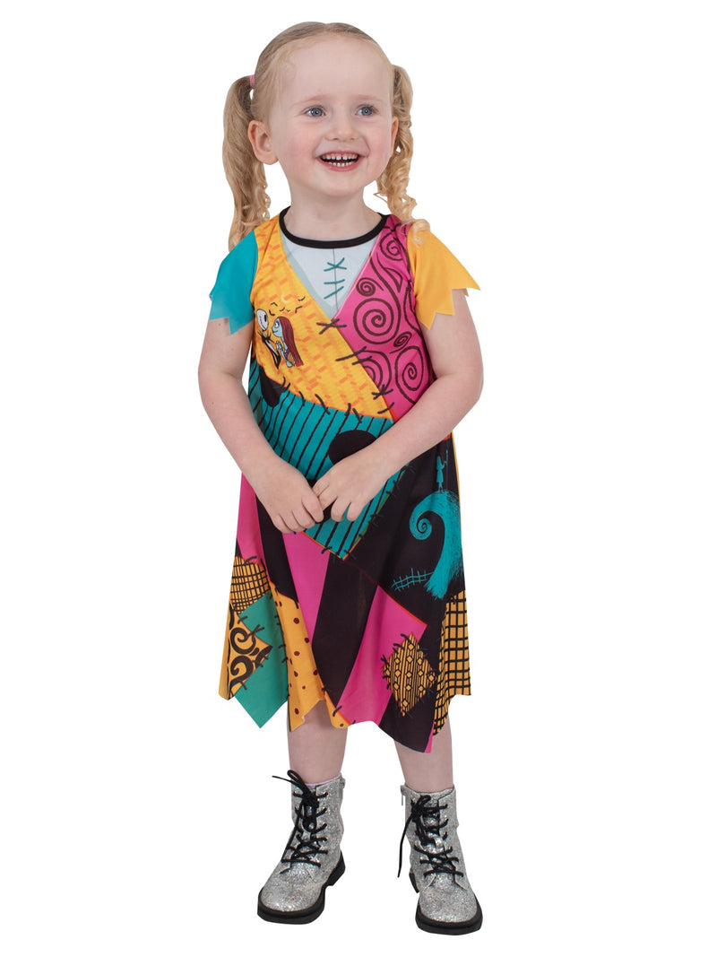 Close-up of Sally costume dress showing Jack and Sally character art at chest with multi-color patchwork print