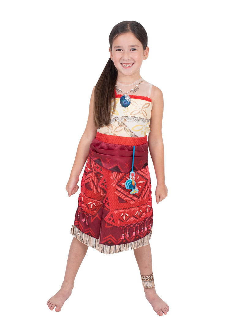 Close-up of Disney Moana dress showing coral and pink Polynesian patterns with beige fringe hem