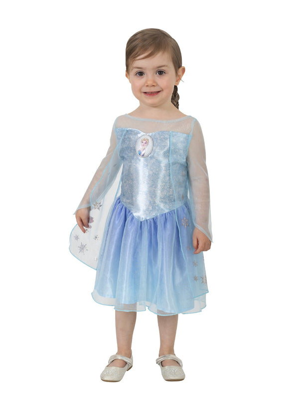 Toddler girl wearing ice-blue Elsa Frozen costume with snowflake cape and character cameo bodice