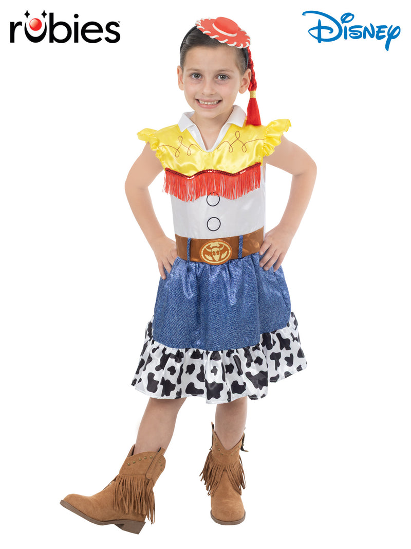Kids Jessie costume from Toy Story showing white bodice with yellow fringe sleeves, red tassels, and cow-print skirt