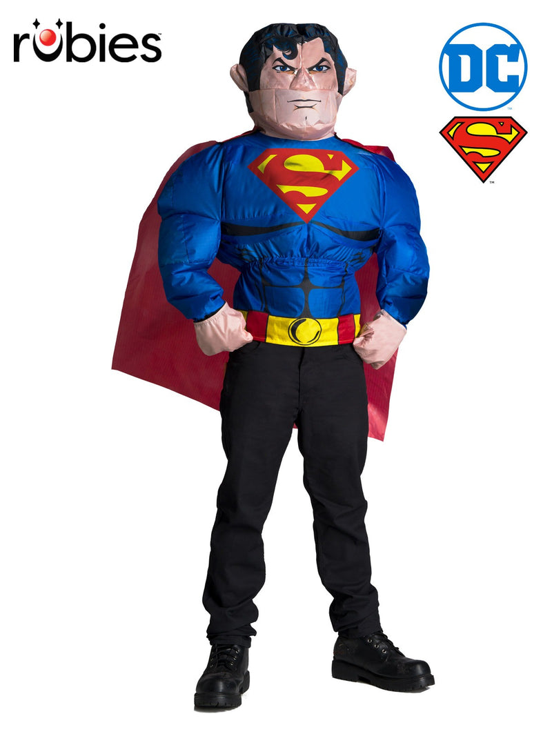 Adult wearing royal blue Superman inflatable muscle costume with red cape and yellow chest emblem