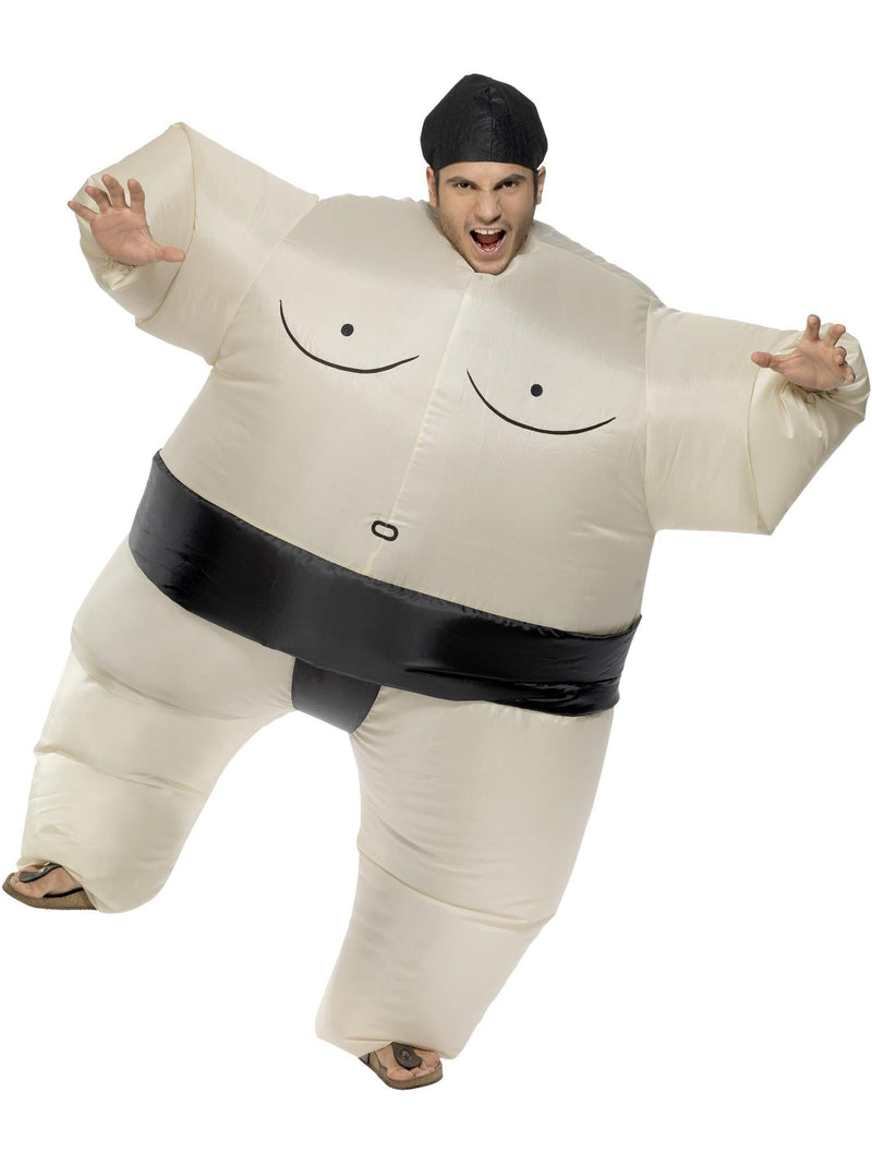 Adult wearing cream inflatable sumo wrestler costume with black belt and headpiece