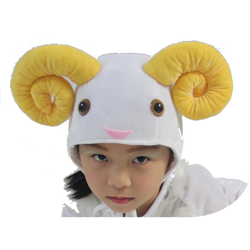 Kids plush white sheep headpiece with 3D spiral ram horns and embroidered face, worn by a child