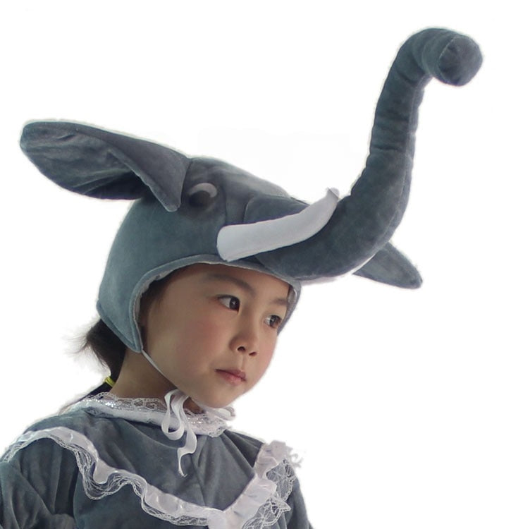Kids plush gray elephant headpiece with 3D upward-curved trunk, oversized ear, and white tusk detail, shown from front