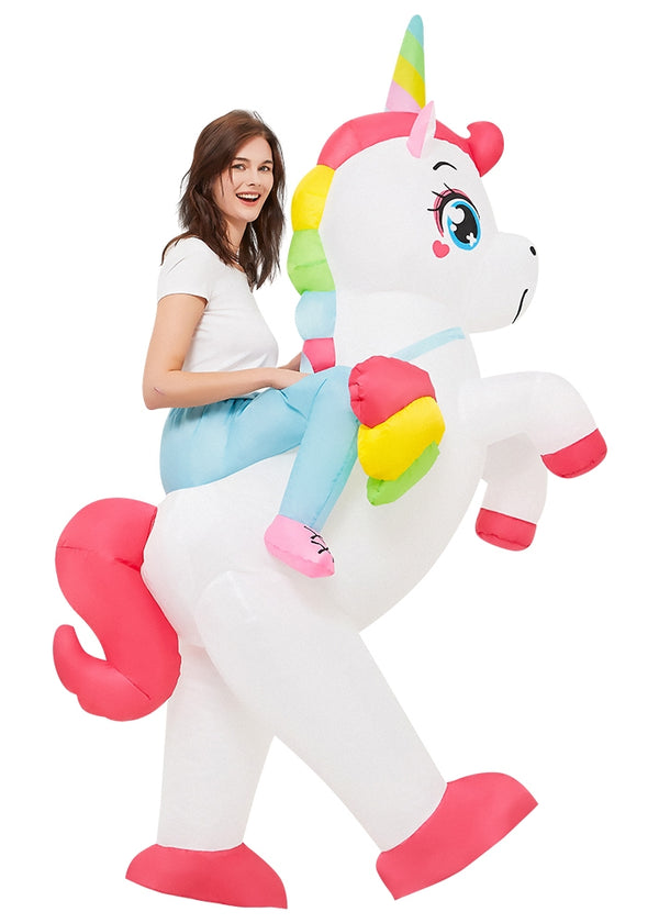 Adult wearing white inflatable unicorn costume with rainbow mane and horn, creating ride-on illusion