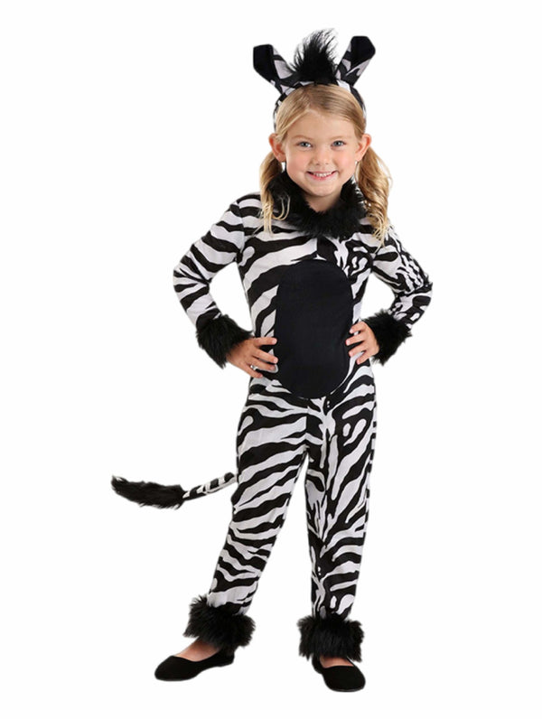 Child wearing black and white striped zebra costume with tail and ears headpiece
