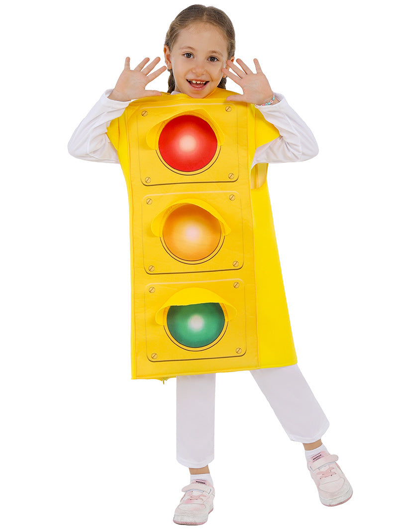 Child wearing bright yellow traffic light costume with red, amber and green circular lights down the front