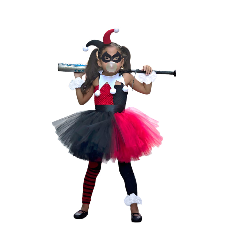Child wearing red and black jester costume with asymmetric tutu skirt and two-tone hat