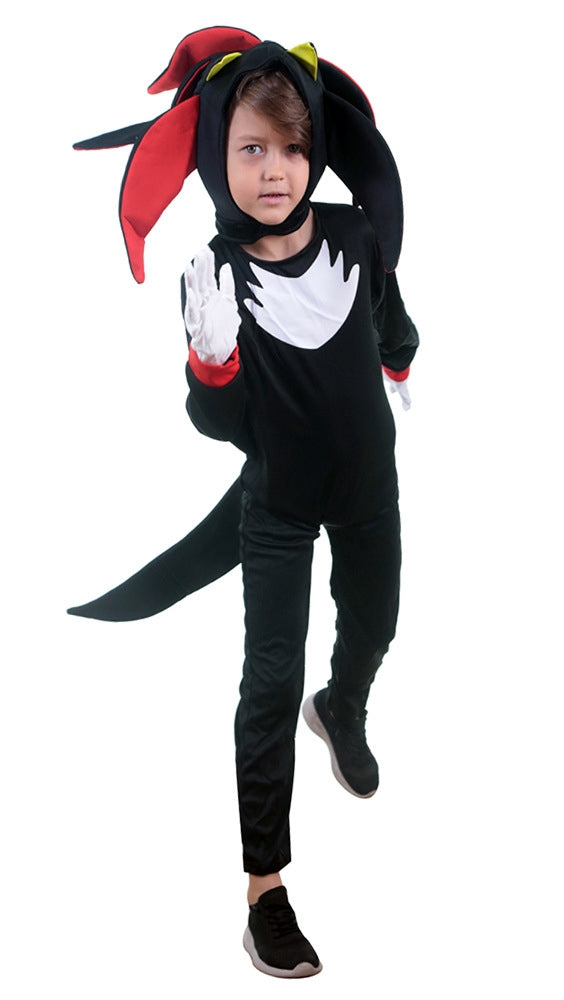 Child wearing black fire dragon costume with red wings and tail