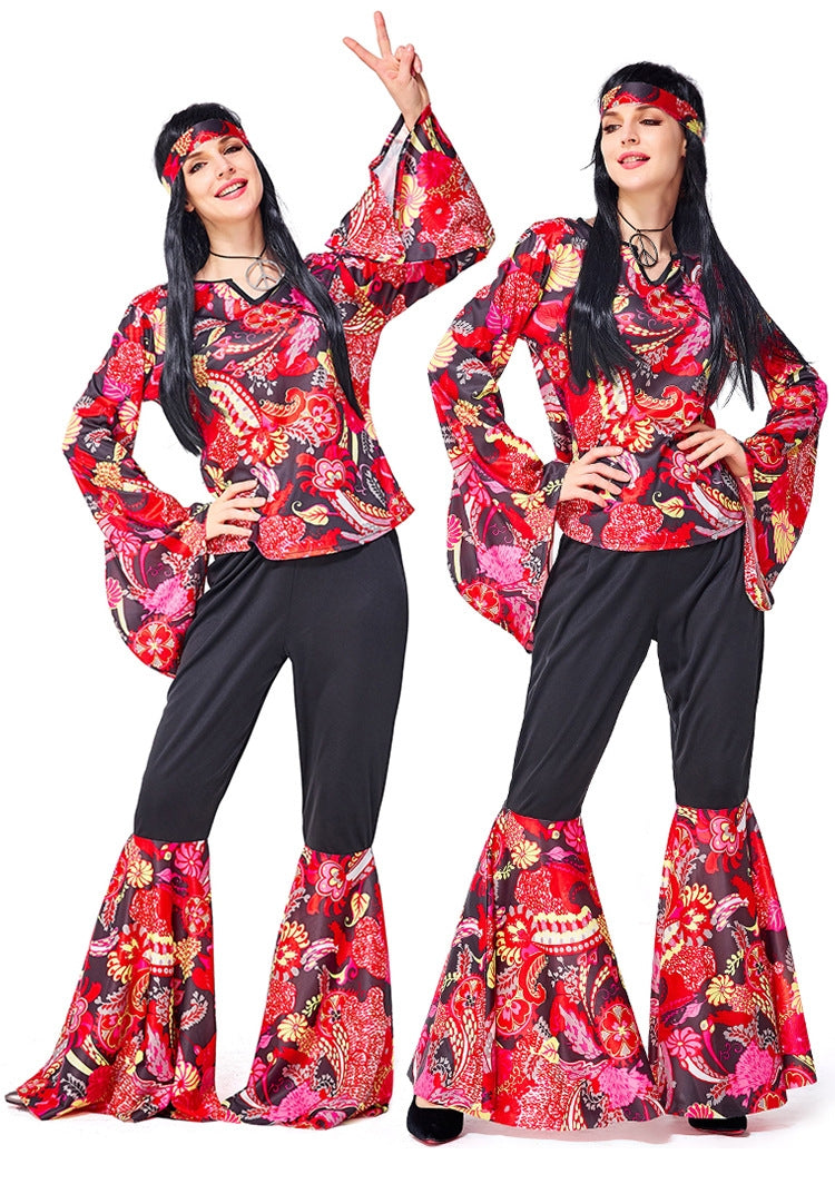 Womens 70s disco costume with paisley bell sleeves and flared pants in hot pink, red and yellow swirls